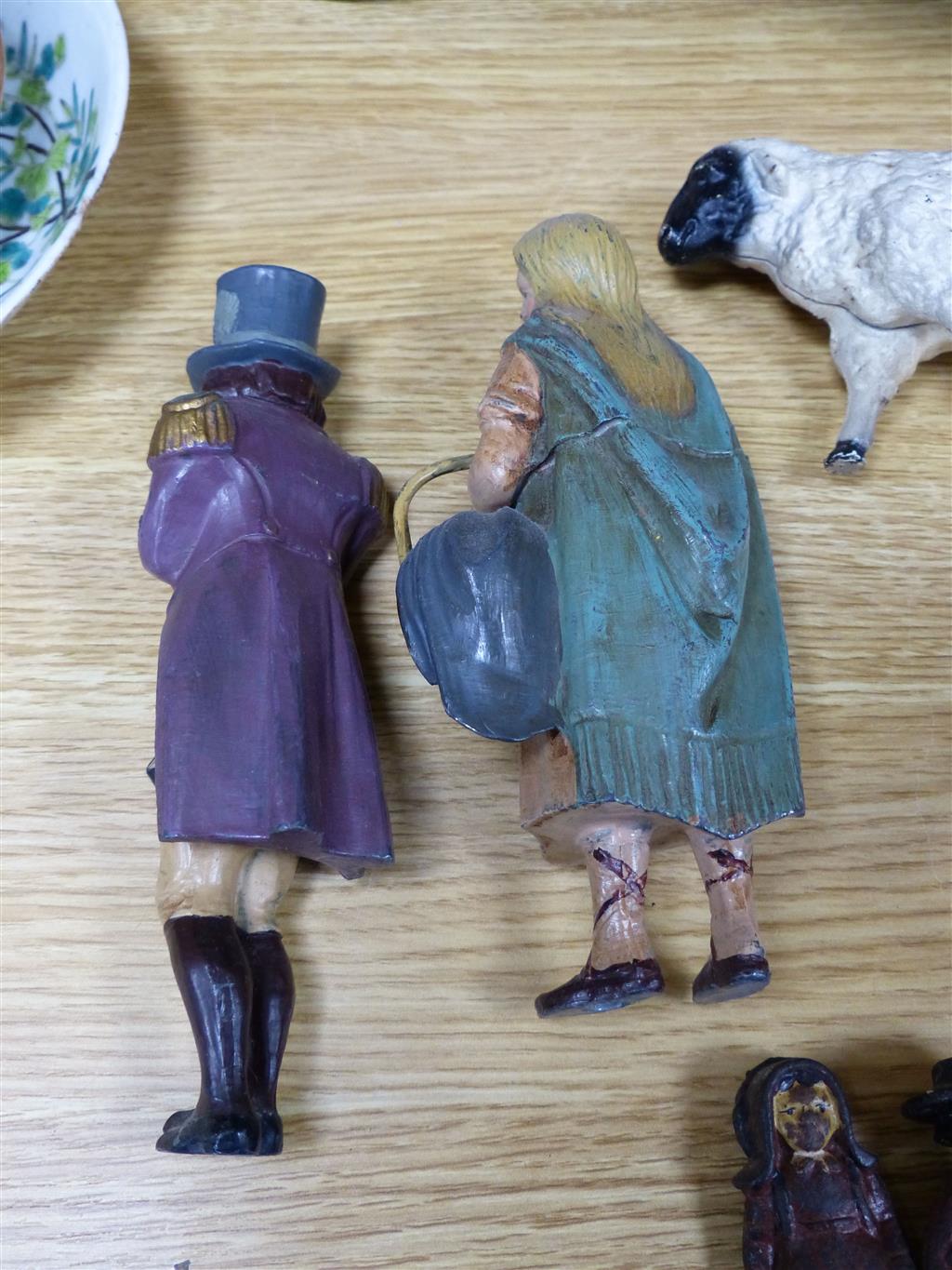 A group of American? painted cast iron and metal Amish figures, sheep money box etc.